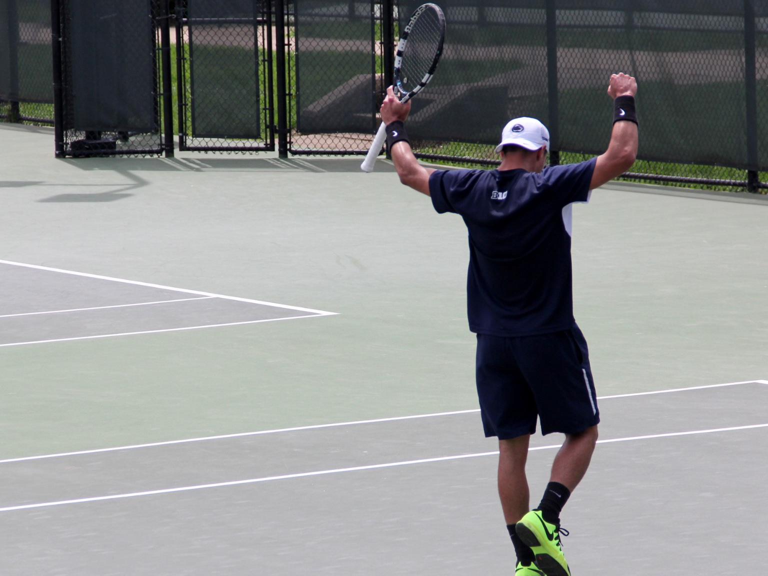 Marc Collado celebrating a win on the tennis court.