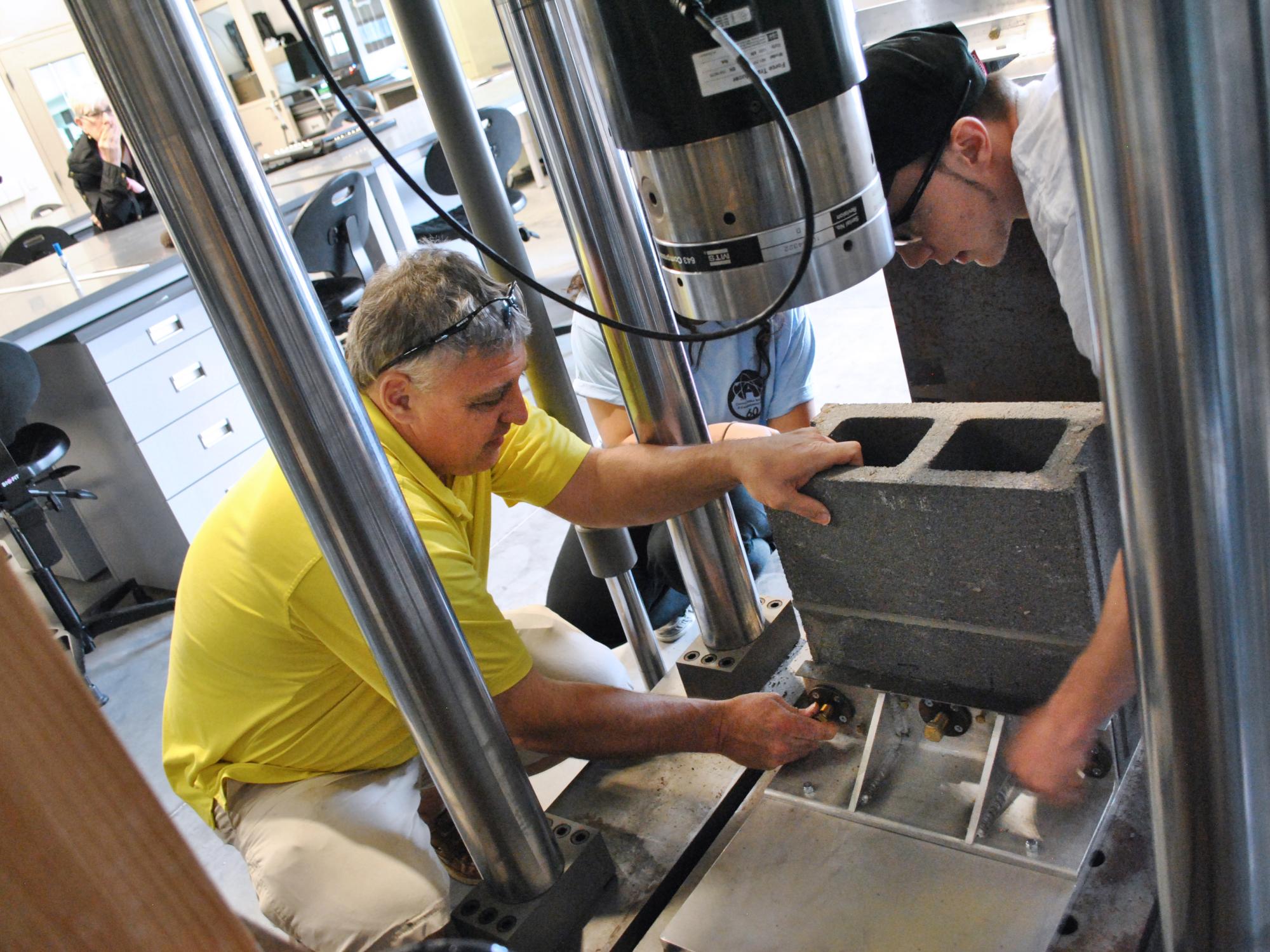 Michael Young and Kienan Dalesandro test concrete