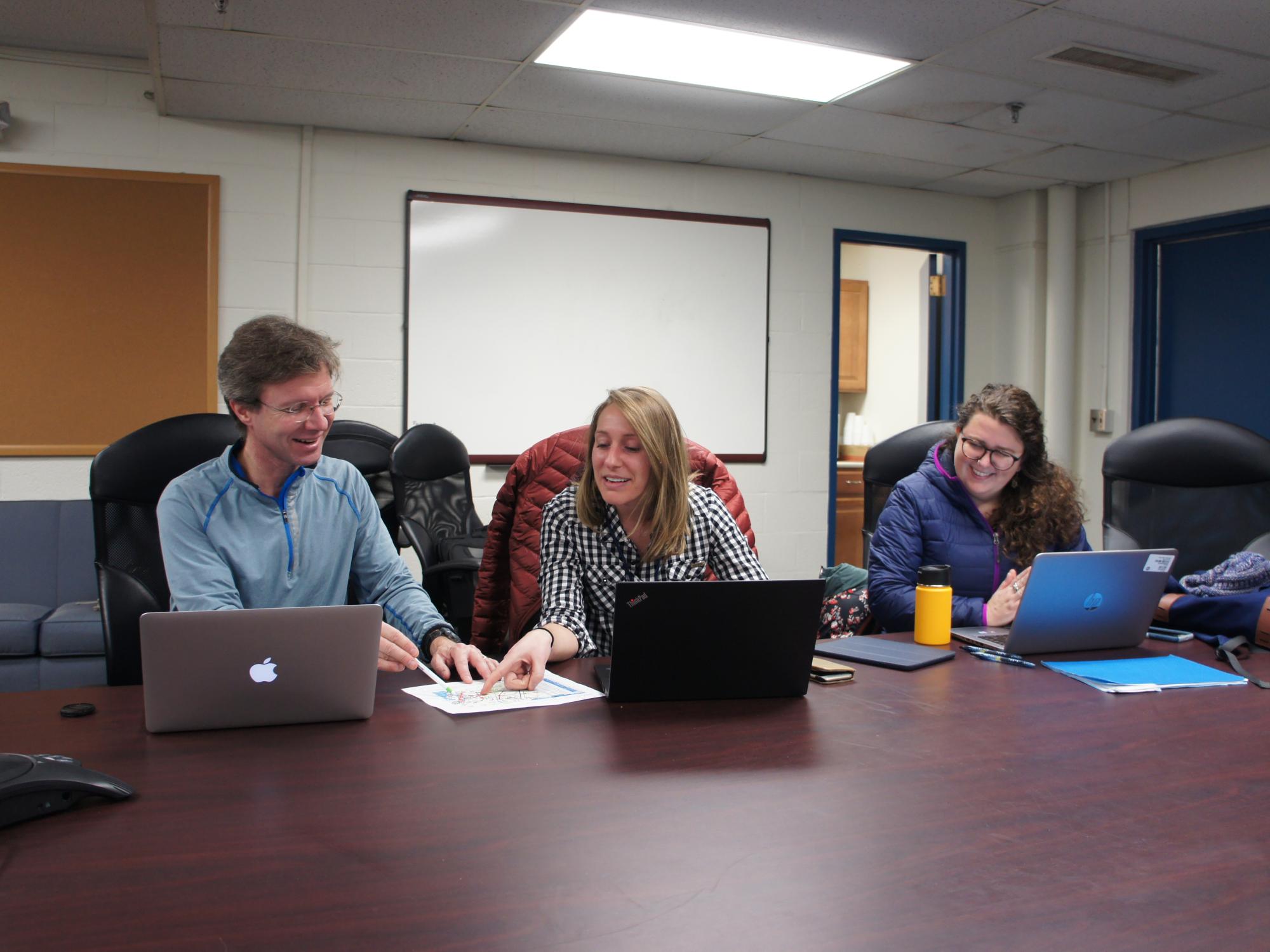 Researchers review notes on airborne research project 