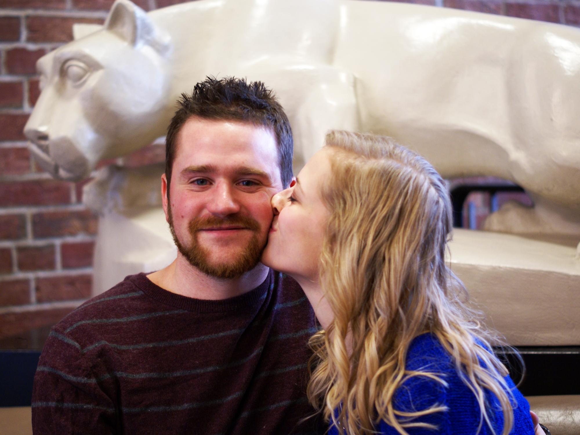 Ashley Myerski kisses Greg Zyhowski on the cheek after proposal