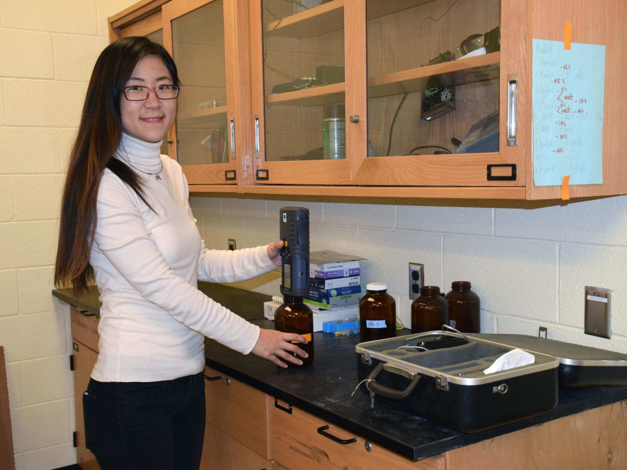 Fangle Chang measuring a scent sample