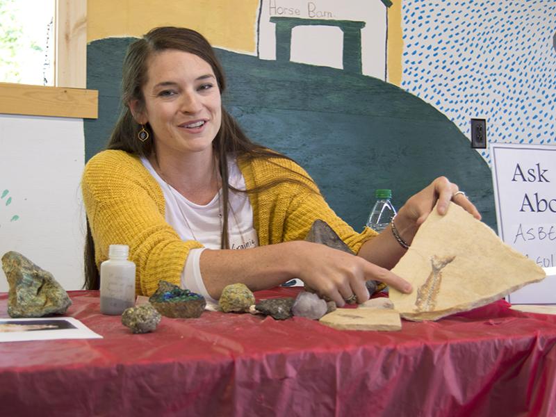 Virginia Marcon, a Ph.D. candidate in geosciences and co-president of the group WE ARE for Science, talks to children about this fish imprint during the group's Ask a Scientist event recently at the Grange Fair.