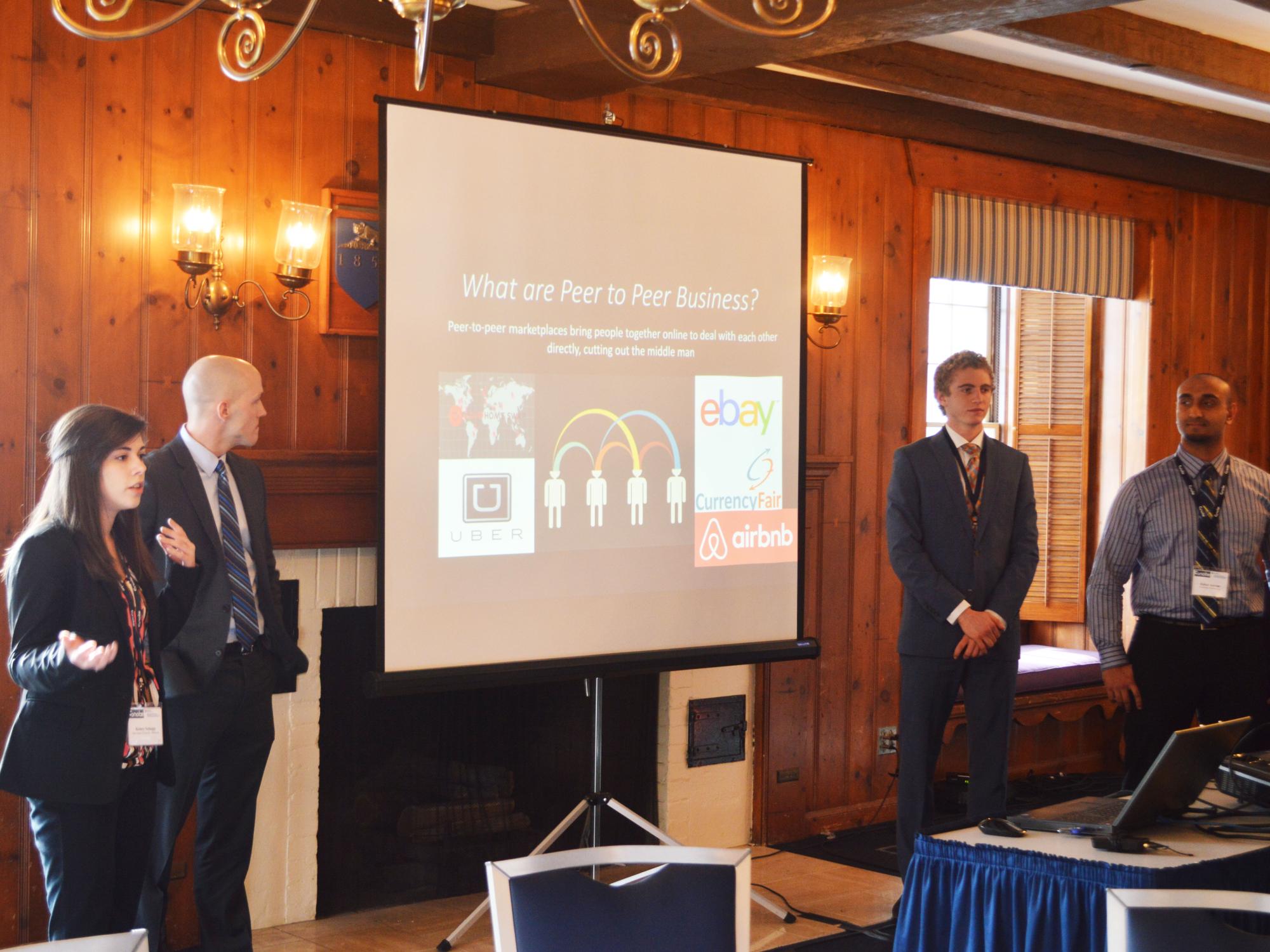 One of the top four teams presents its case solution to the judges.