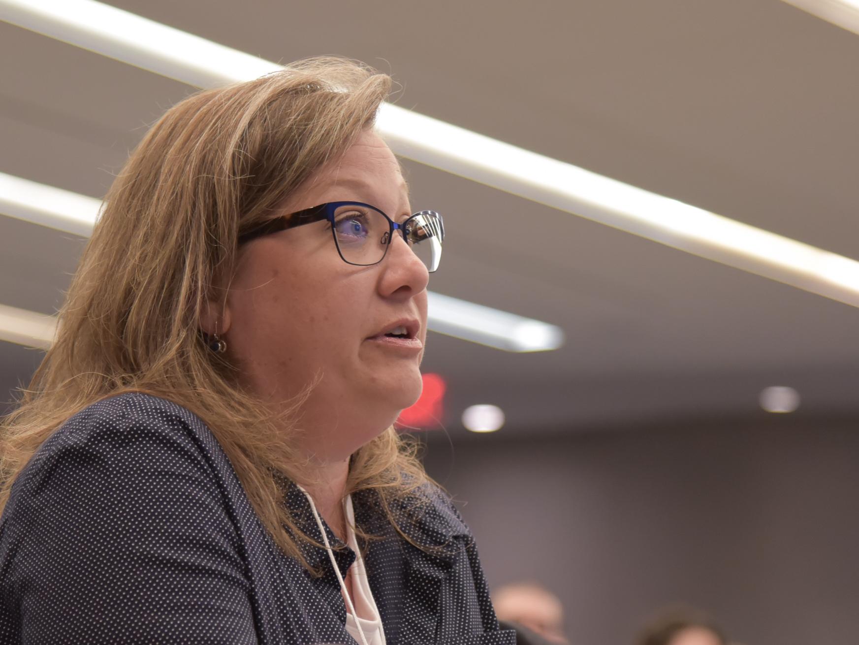 Woman listening intently at a conference
