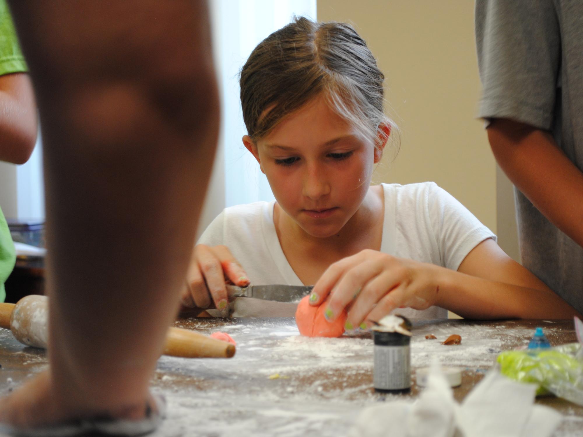 A student works on a food project during Penn State Behrend's College for Kids program.