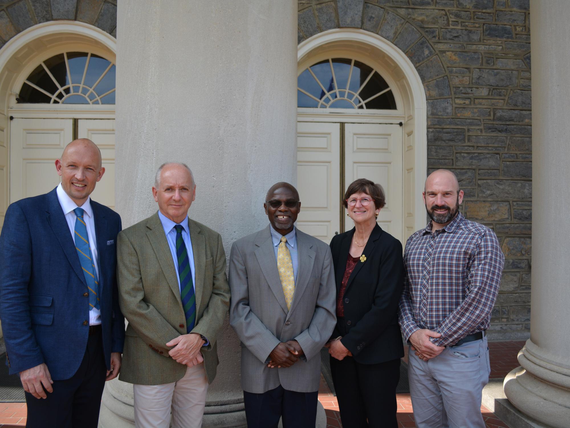 Penn State leaders stand outside of Old Main following signing of MOU