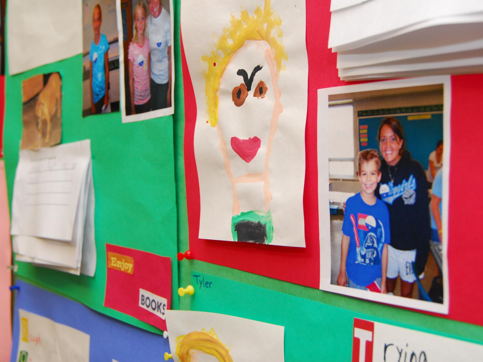 The work of Summer Reading Camp students is displayed on a bulletin board.