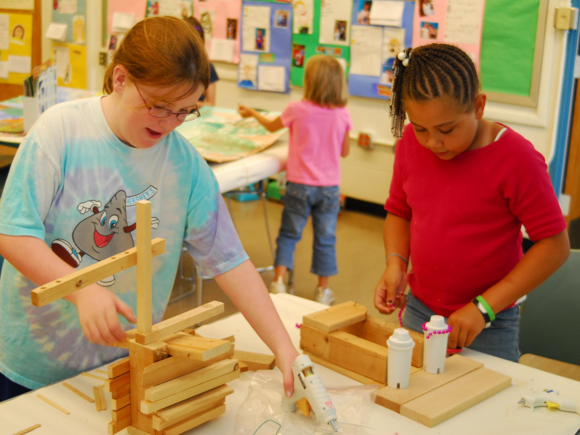 Two Summer Reading Camp participants express themselves through art.