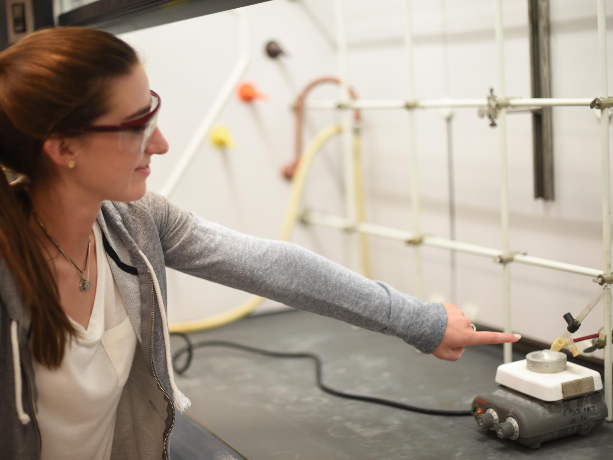 Claire Tushak, a senior at McDowell High School, points at a compound containing an ester.