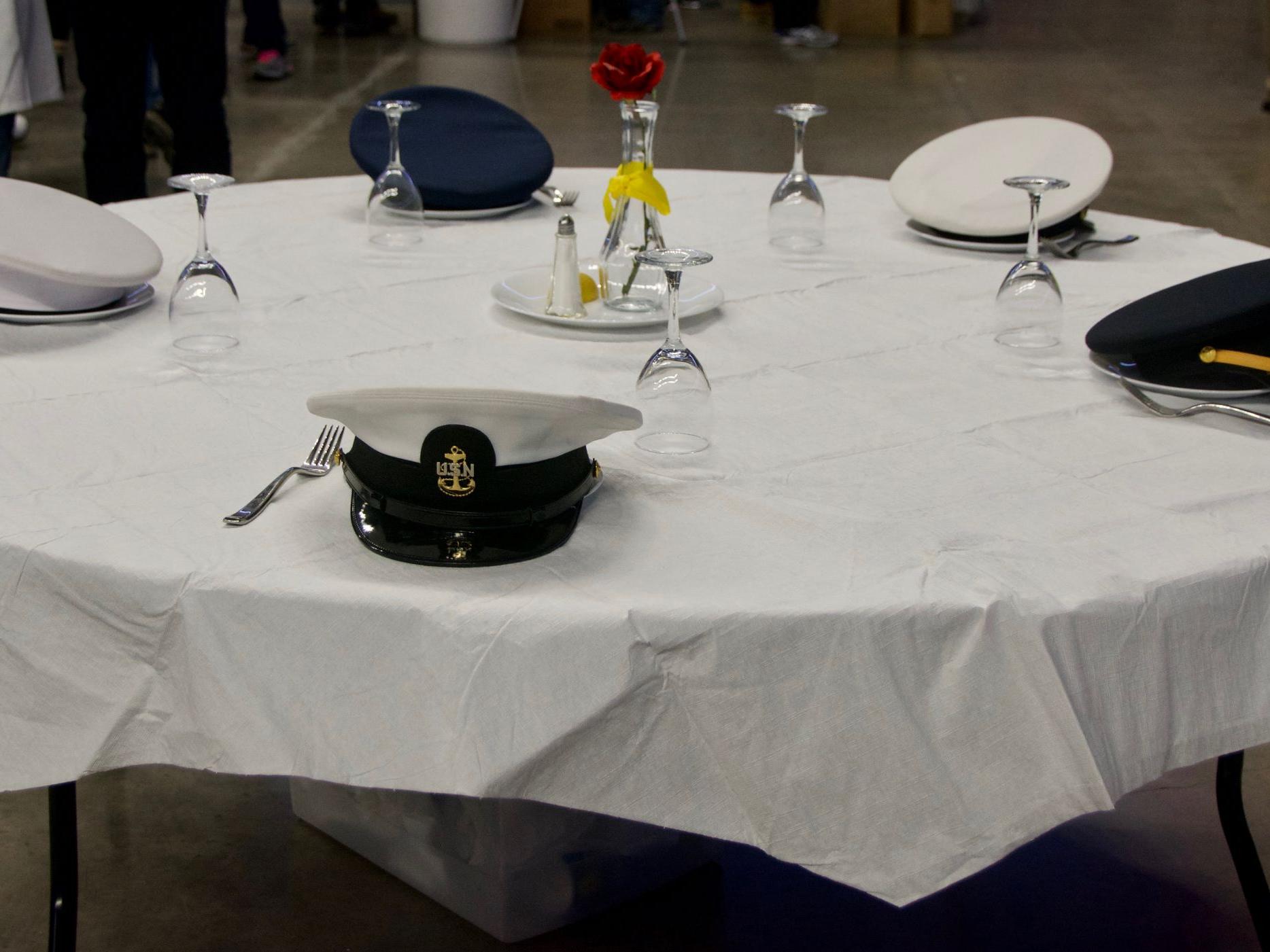 Military hats placed around a table 