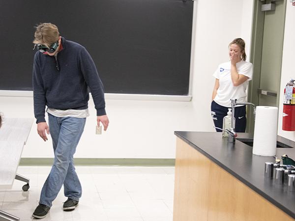 Students wear goggles that simulate the experience of being under the influence.