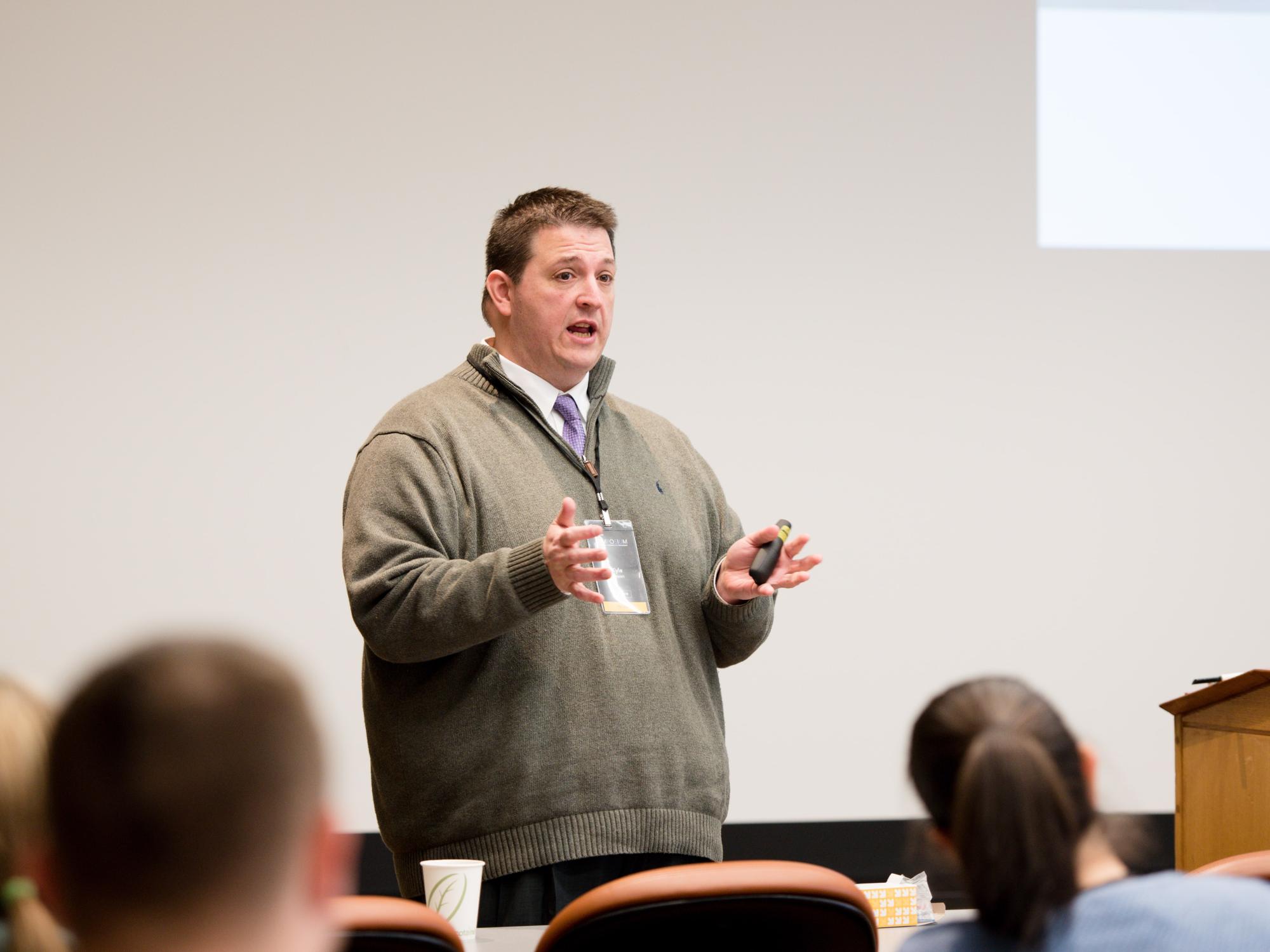 Kyle Bowen addresses attendees in session