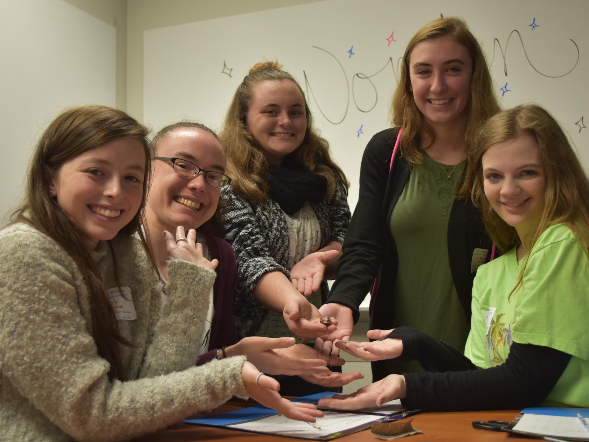 Meadville High School students shown holding their prized battery.
