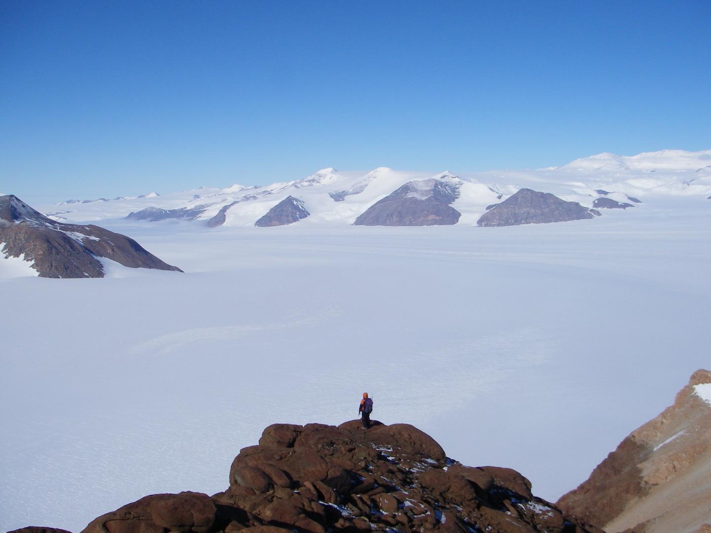 Person looks over massive glaciers 