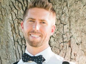 head shot of David Whitlock by a tree
