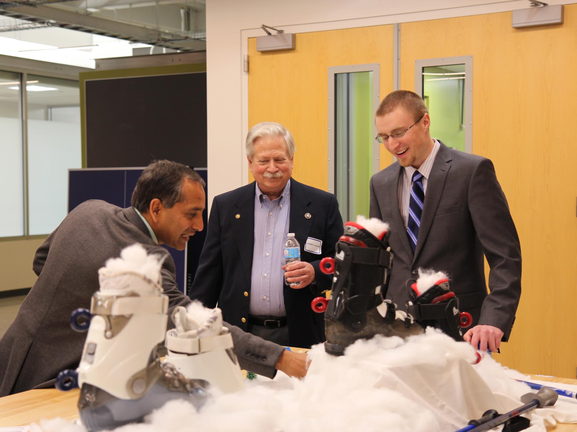 Guests discussing with SEG team member