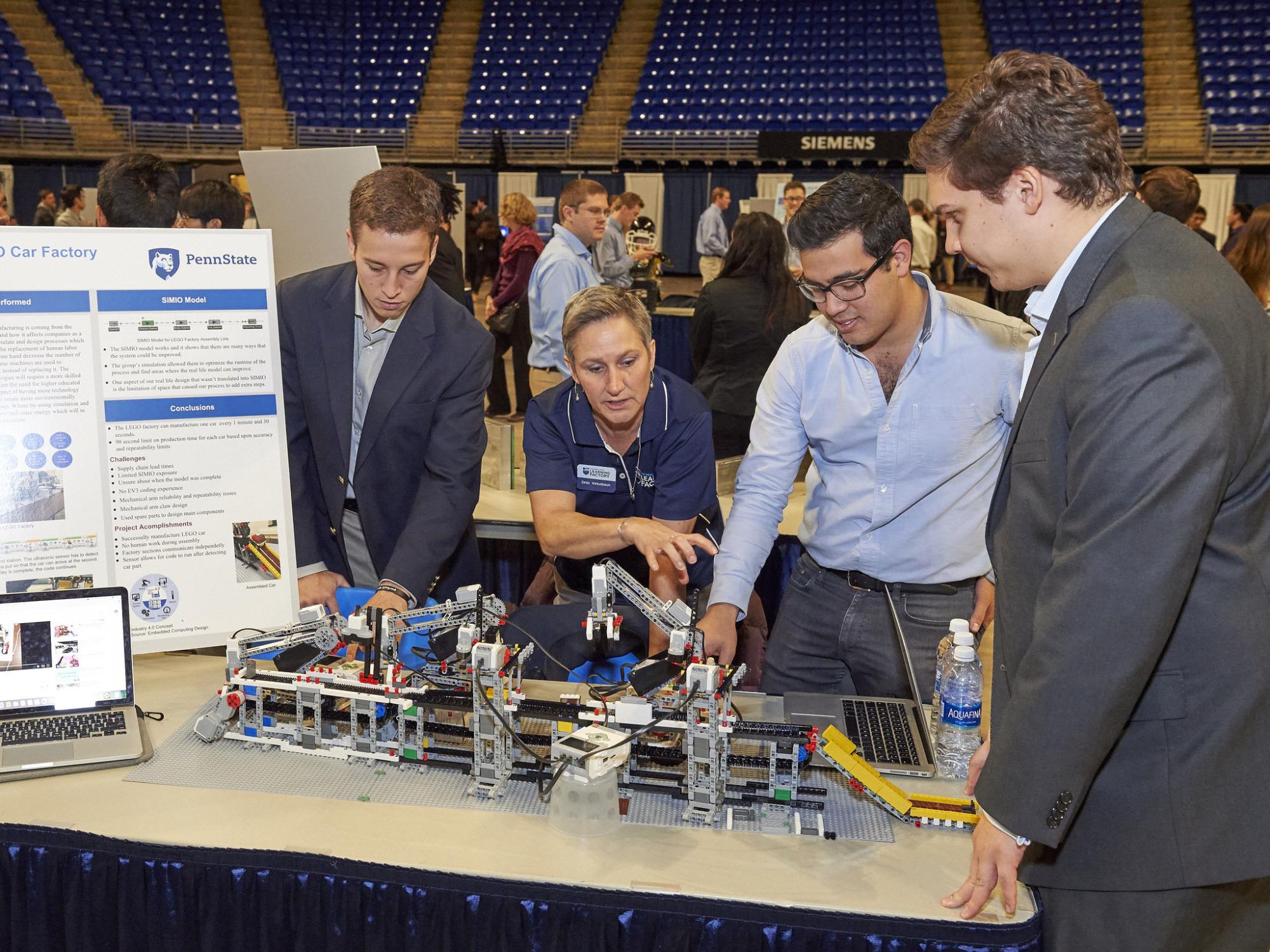 Students display their projects during the fall 2016 Design Showcase