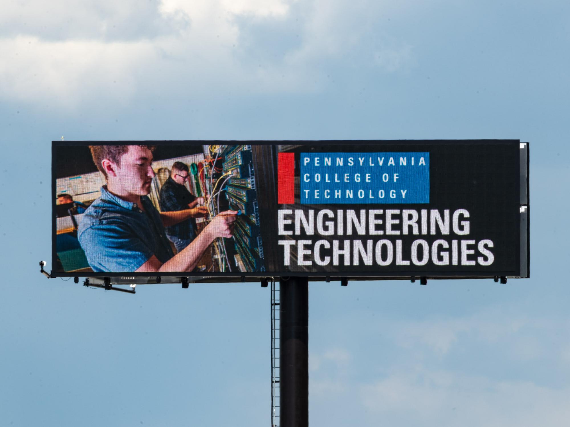 A digital sign displaying an ad for Penn College