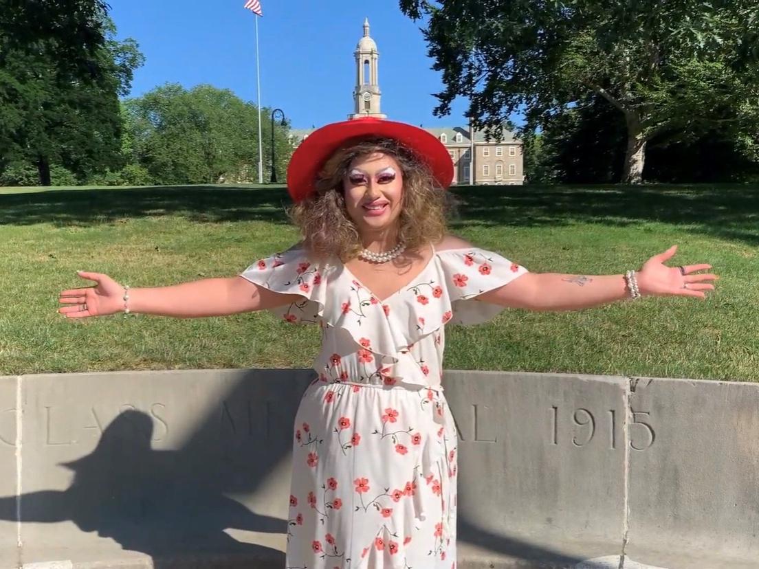 Center for Sexual and Gender Diversity (CSGD) program coordinator Eric Duran poses in drag in front of Old Main