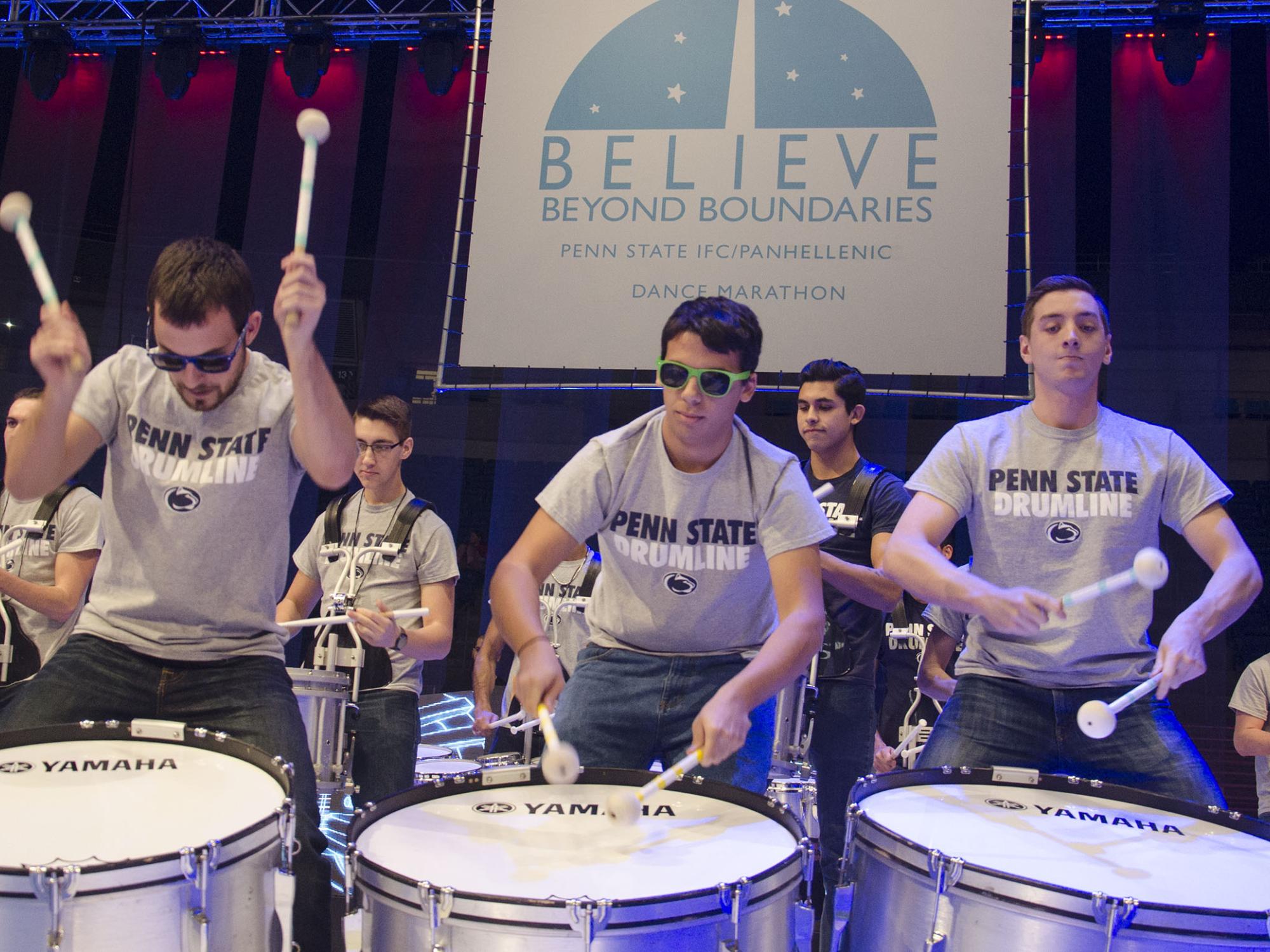 Members of Drumline drumming 