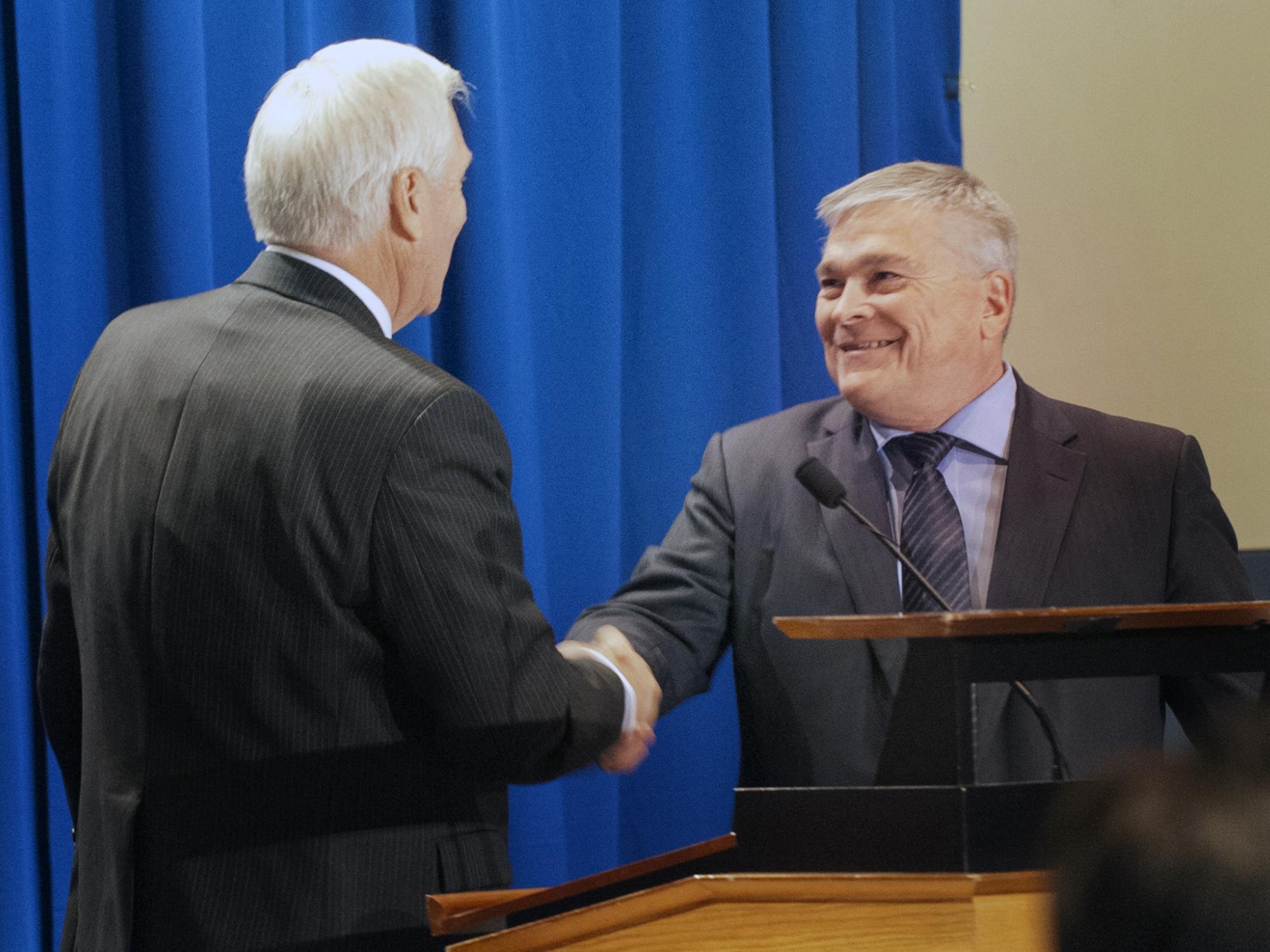 Eric Barron greeted by Dr. Erickson