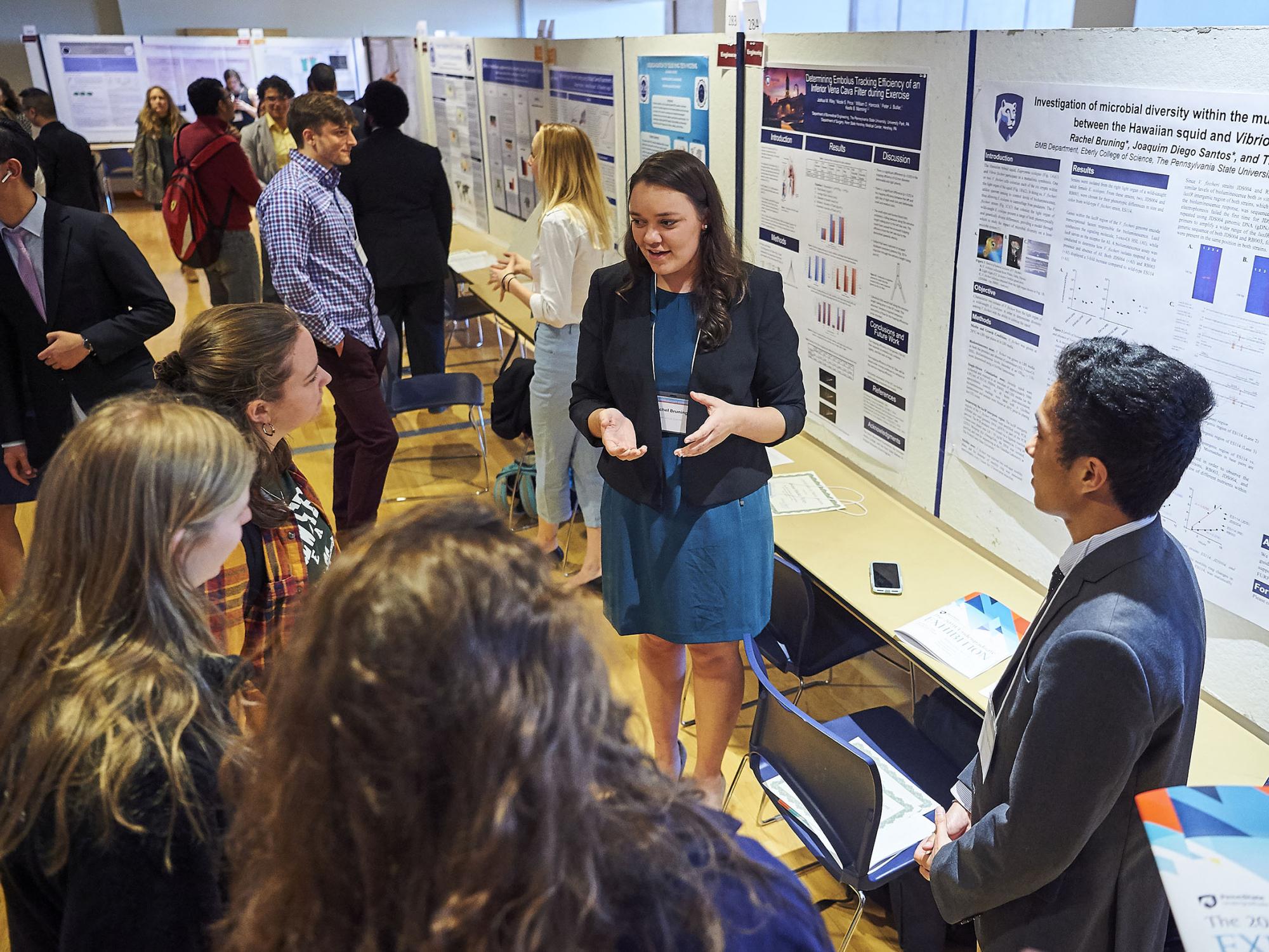 Rachel Bruning explains her poster to other students