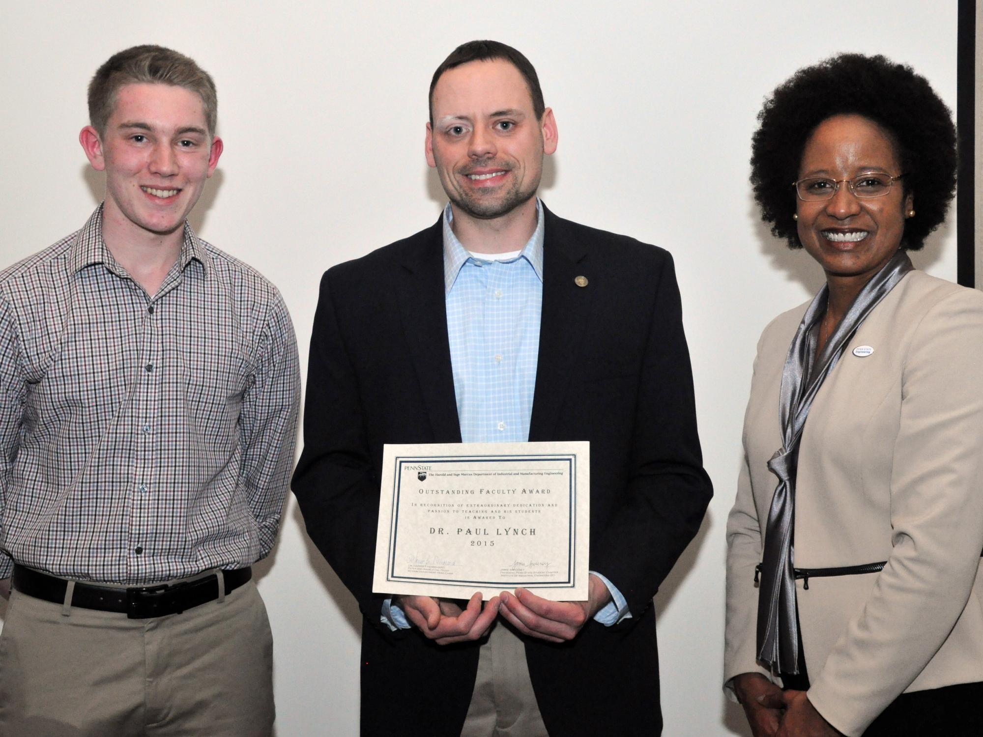 Lecturer and Academic Adviser Paul Lynch is presented with the Outstanding Faculty Award