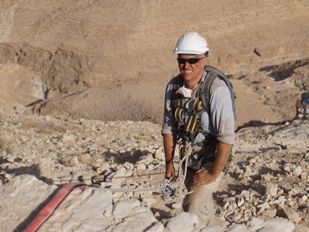 Falk in climbing gear to reach cave