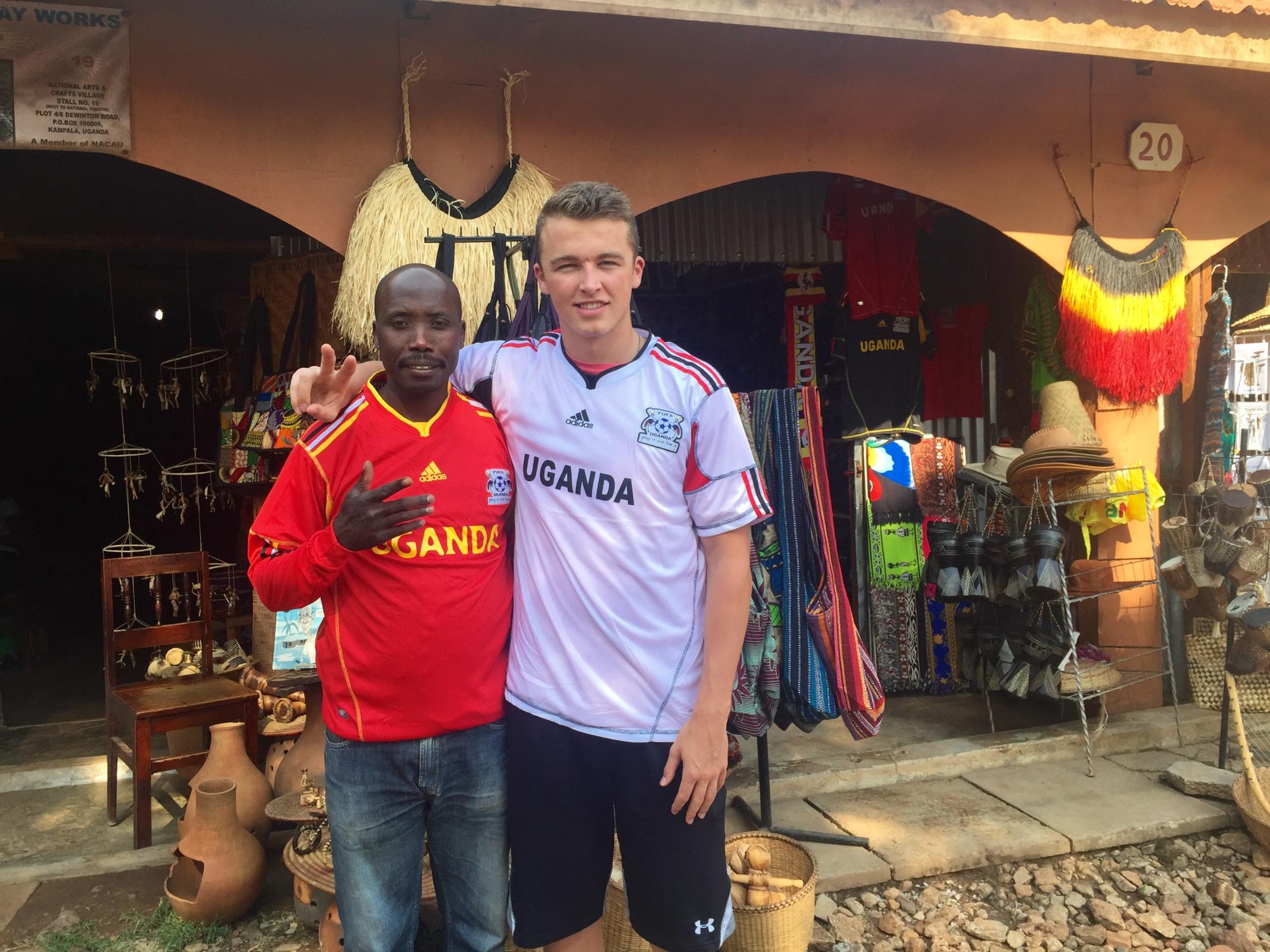 Matt Quillen with tour guide in Uganda