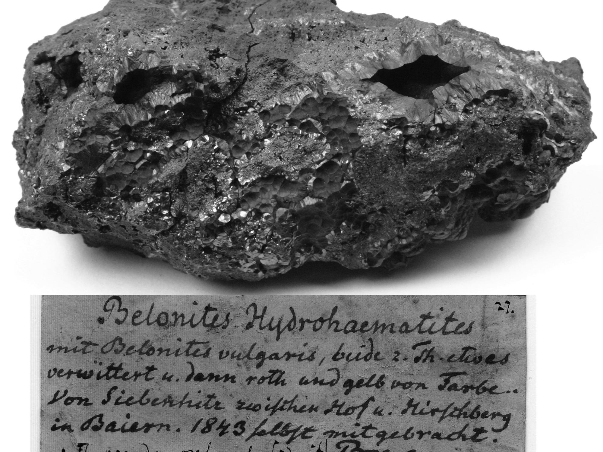 lump of rock with dark red streaks and the original German label