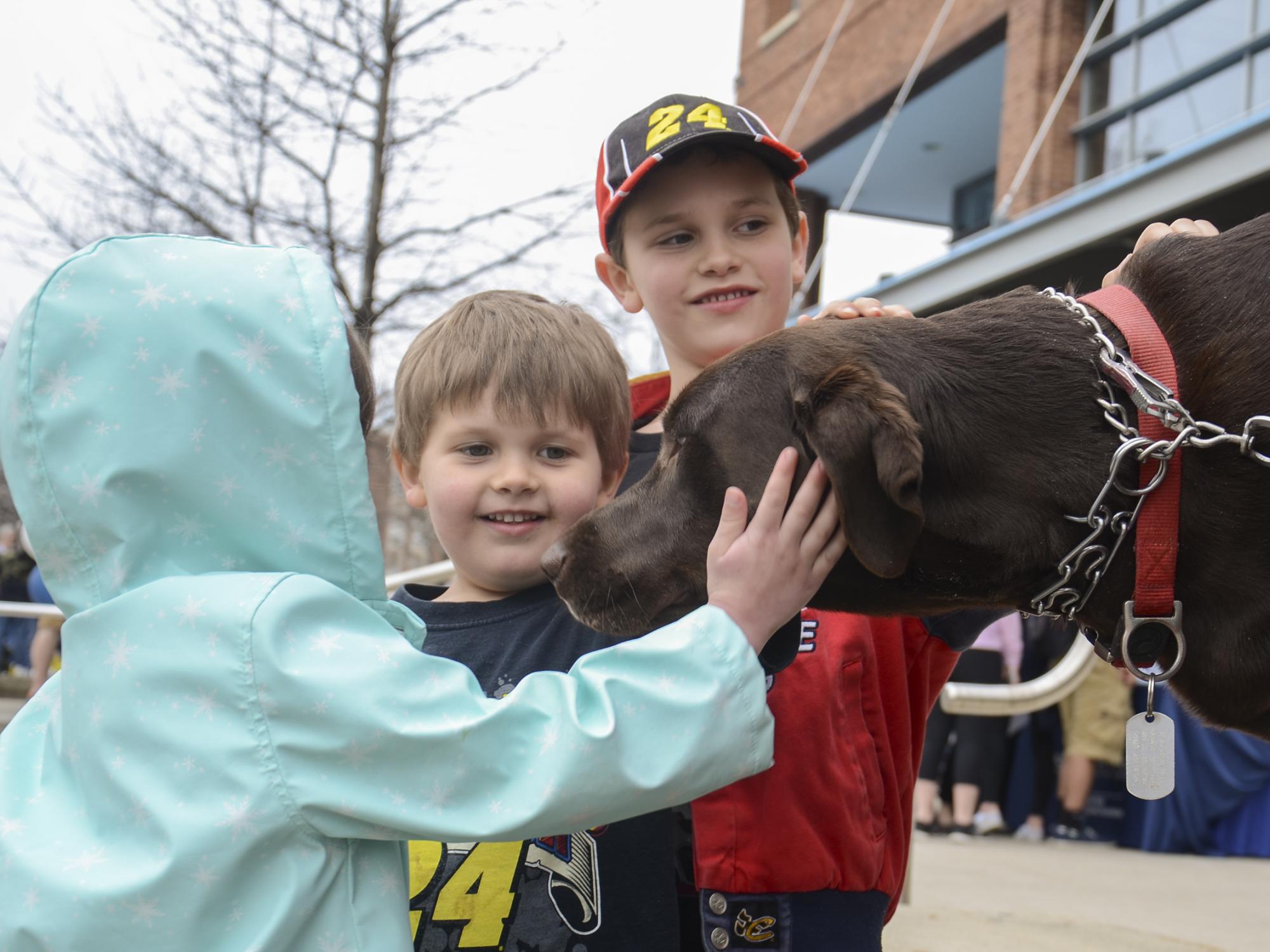 Kids petting a dog