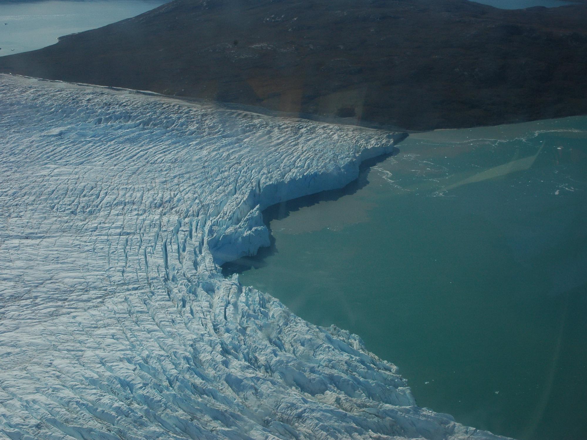 a glacier meets the sea