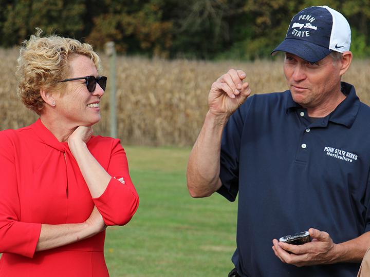 John Rost describes the lanternfly to Congresswoman Houlahan.