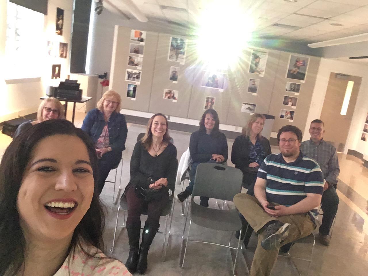 Stephanie Swindle takes a picture of the group at her selfie workshop