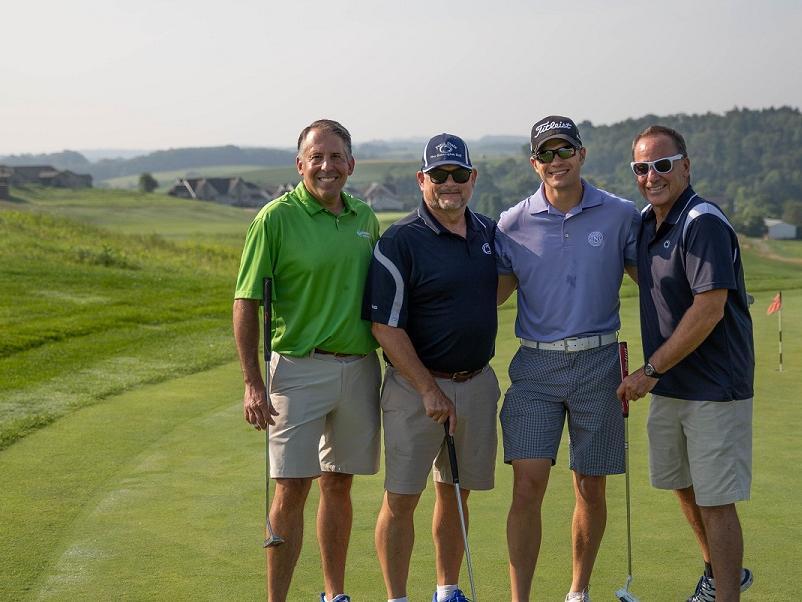Golfers pose for photo at golf outing