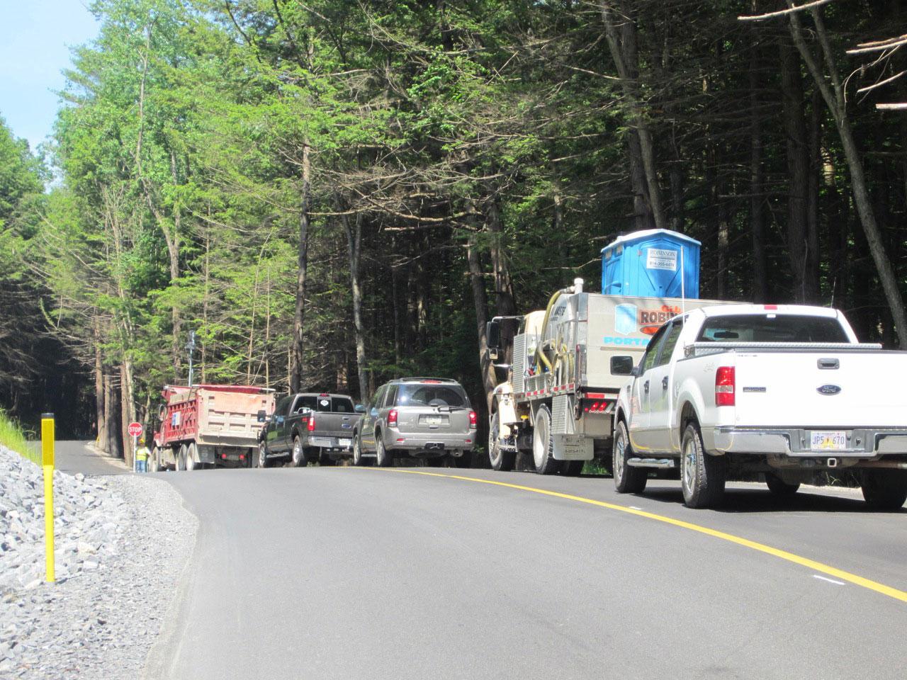 Traffic control stop to prevent conflicts between large trucks on narrow gas access roads within the state forest.