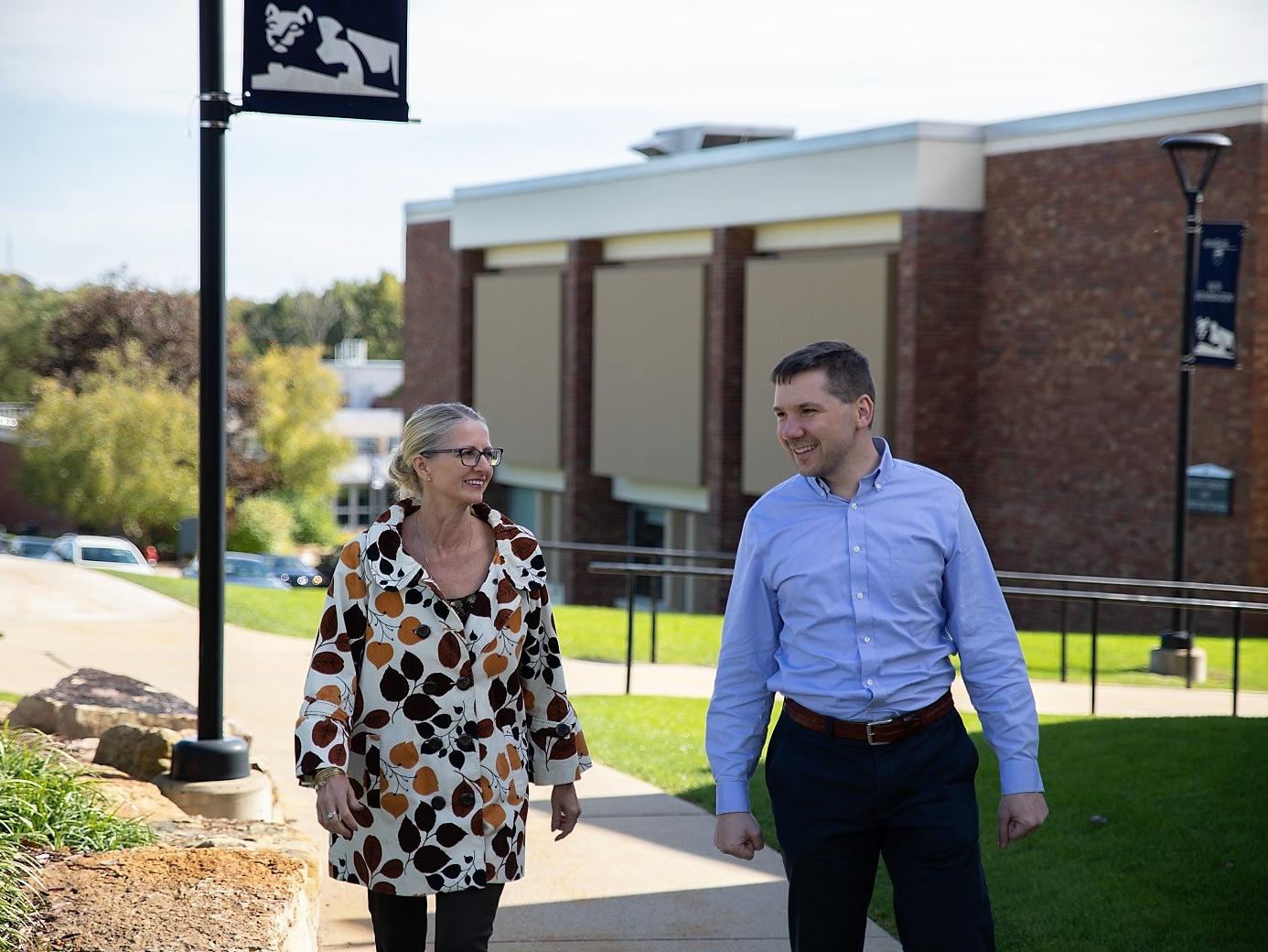 Ruth Herstek and Sean Bridgen walking outside