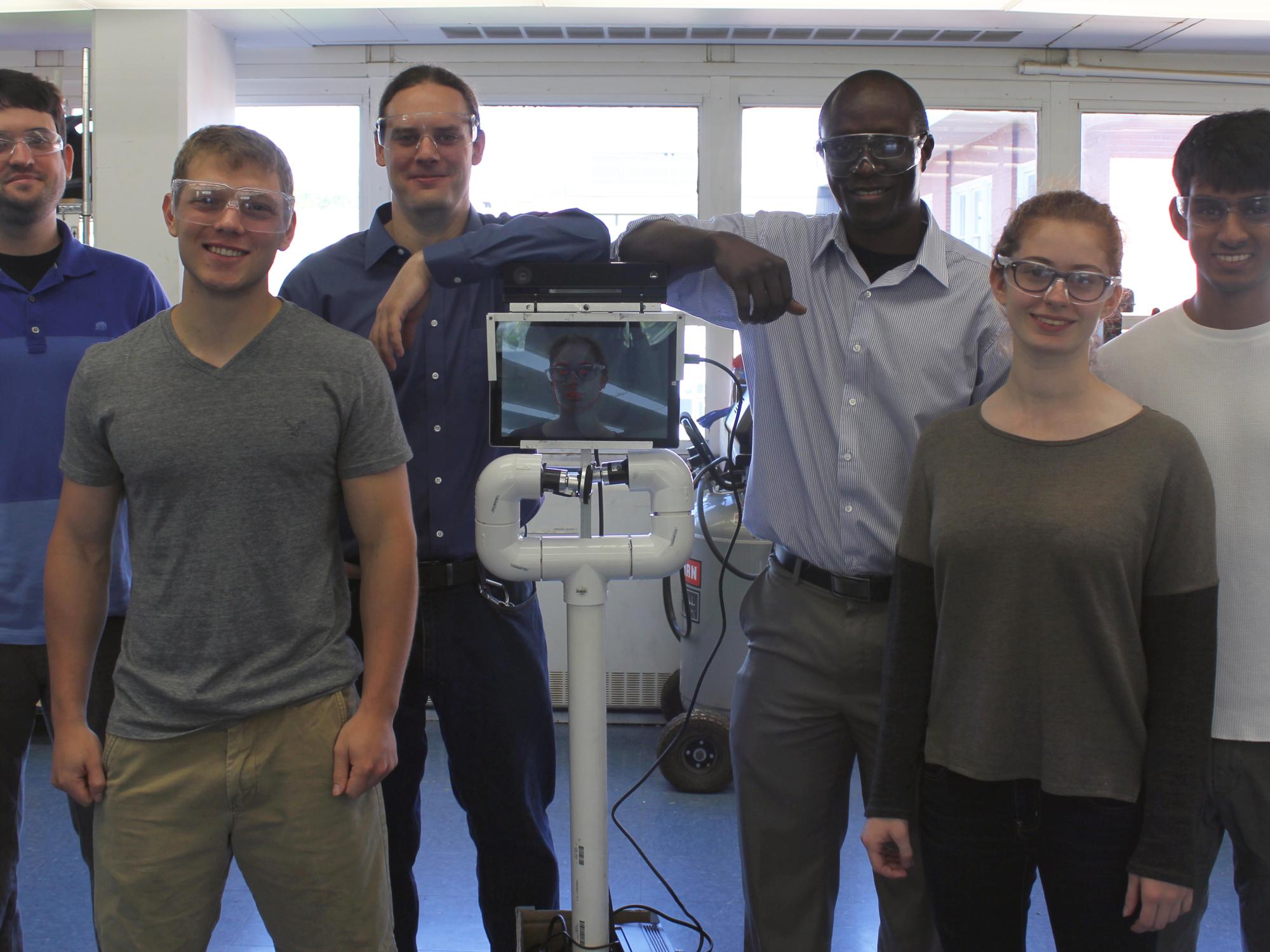 The NSF National Robotics Initiative team at Penn State next to the student-assembled co-robot, called Pennie.
