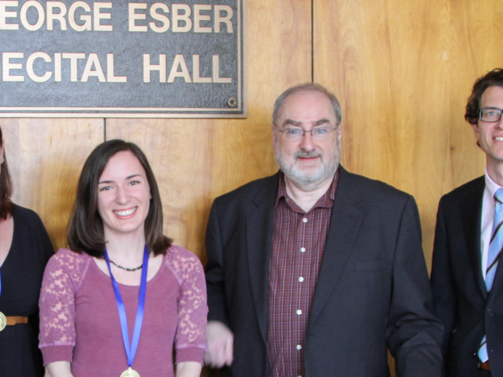 Brian Curran poses for a photograph with award winners after the College Awards Ceremony. 