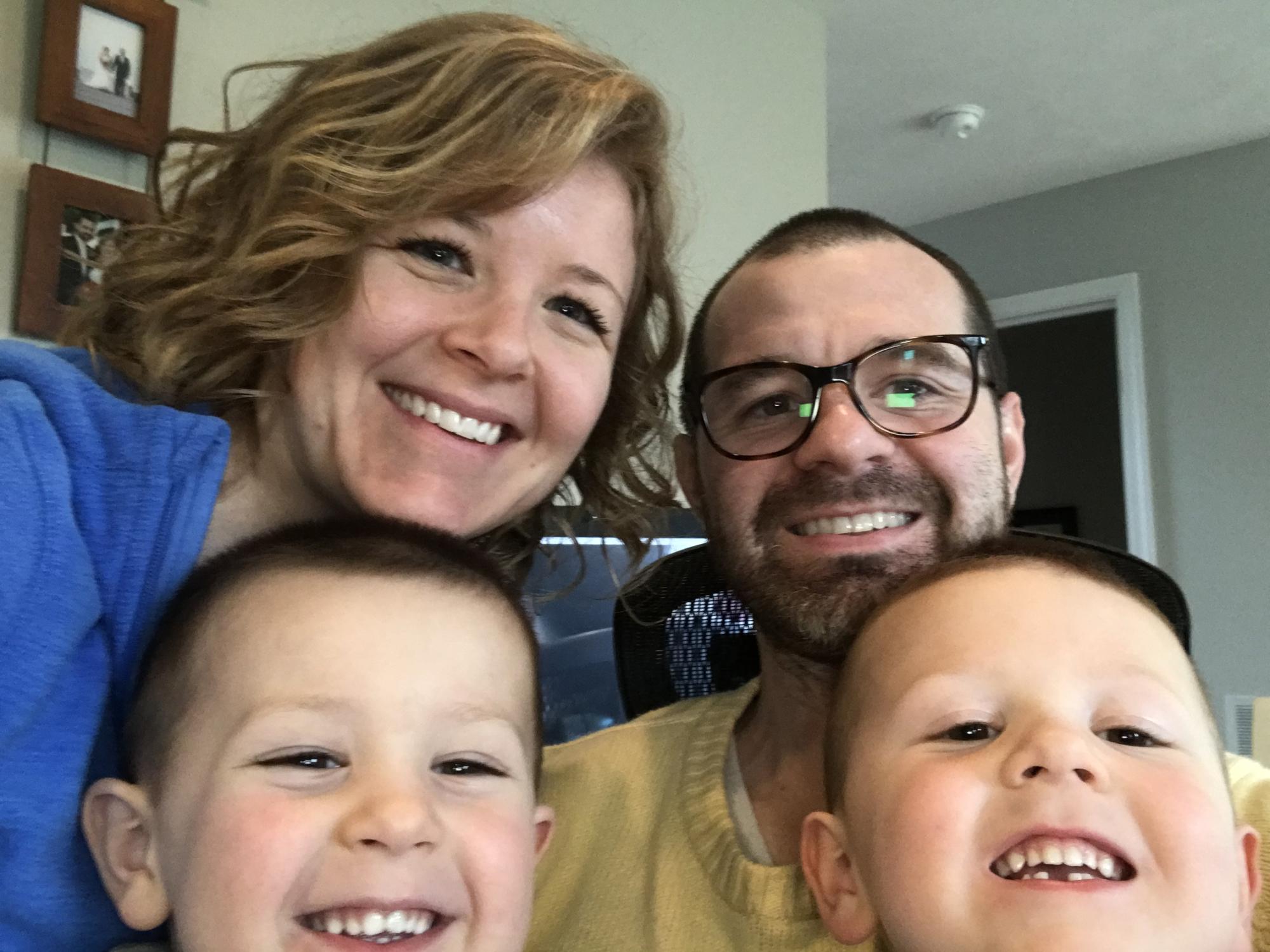 Mother, father and two sons in their home