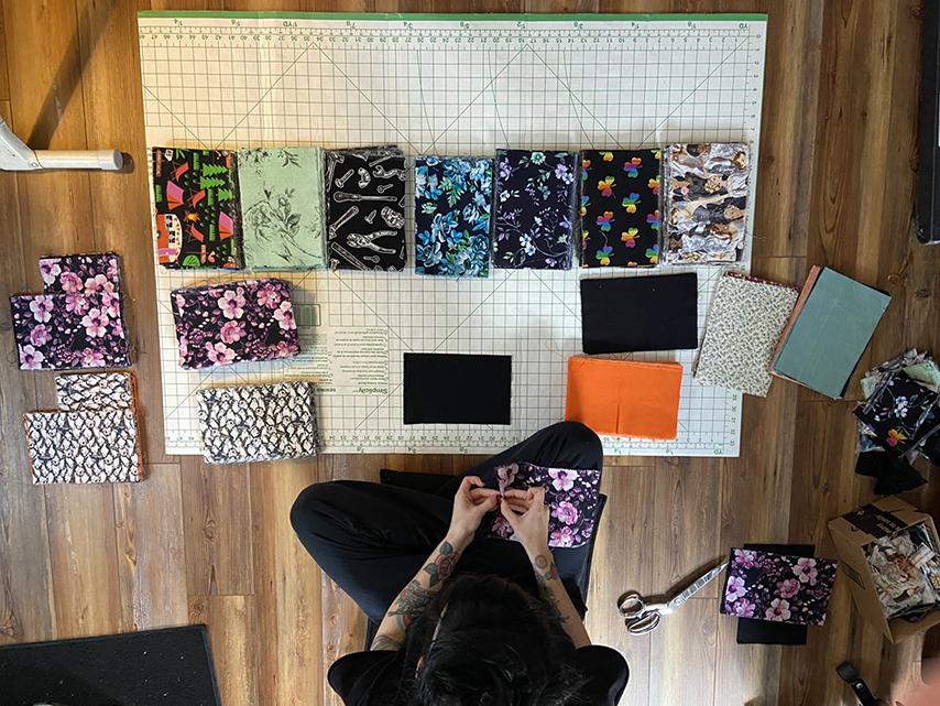 Ferg looking at fabric