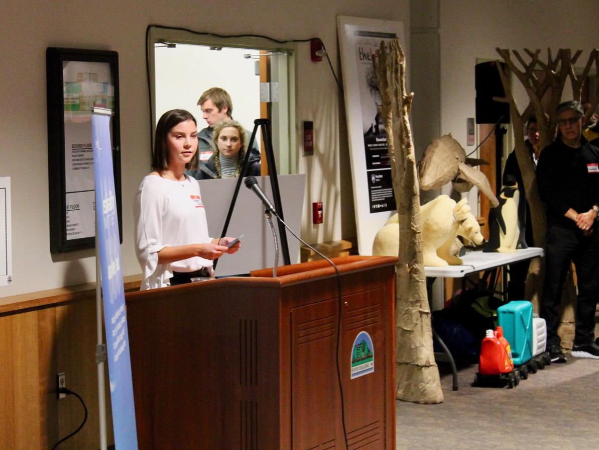 Claire Talley speaks at a podium