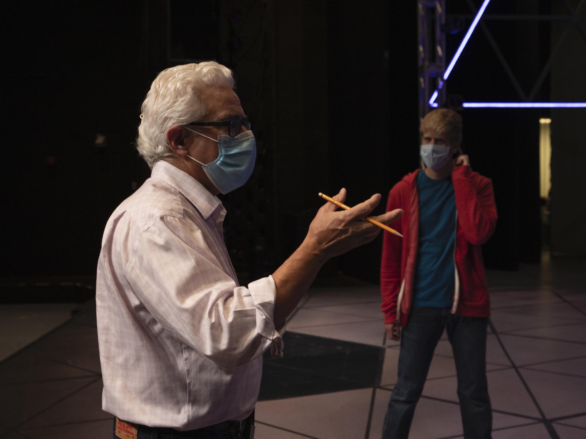 Person gestures with a hand