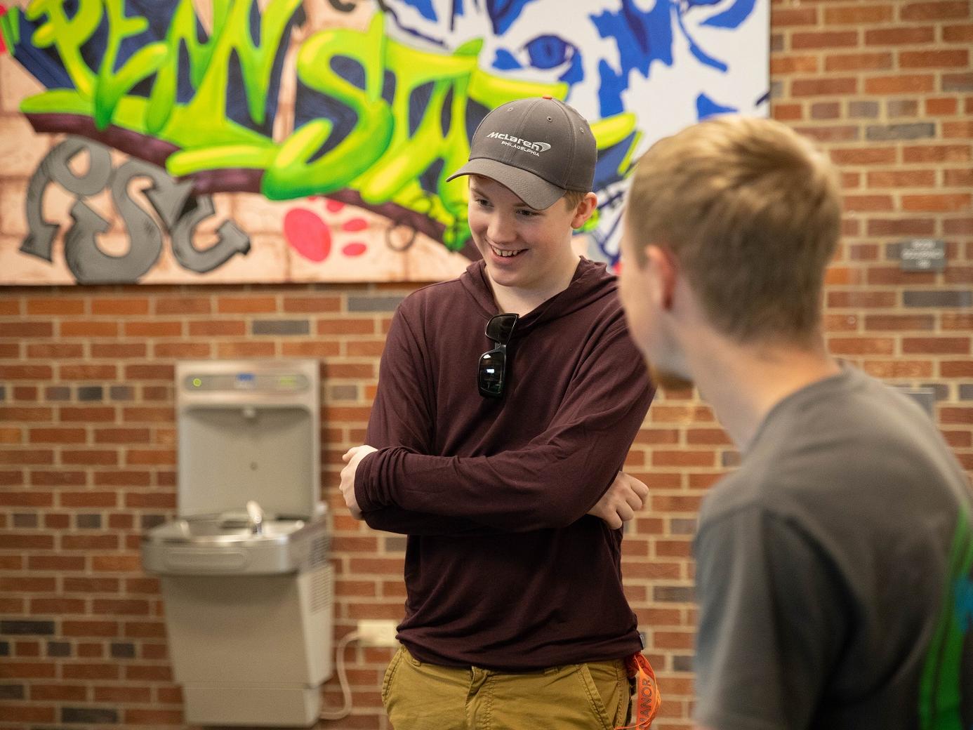 Mackinly Adams laughs with other students