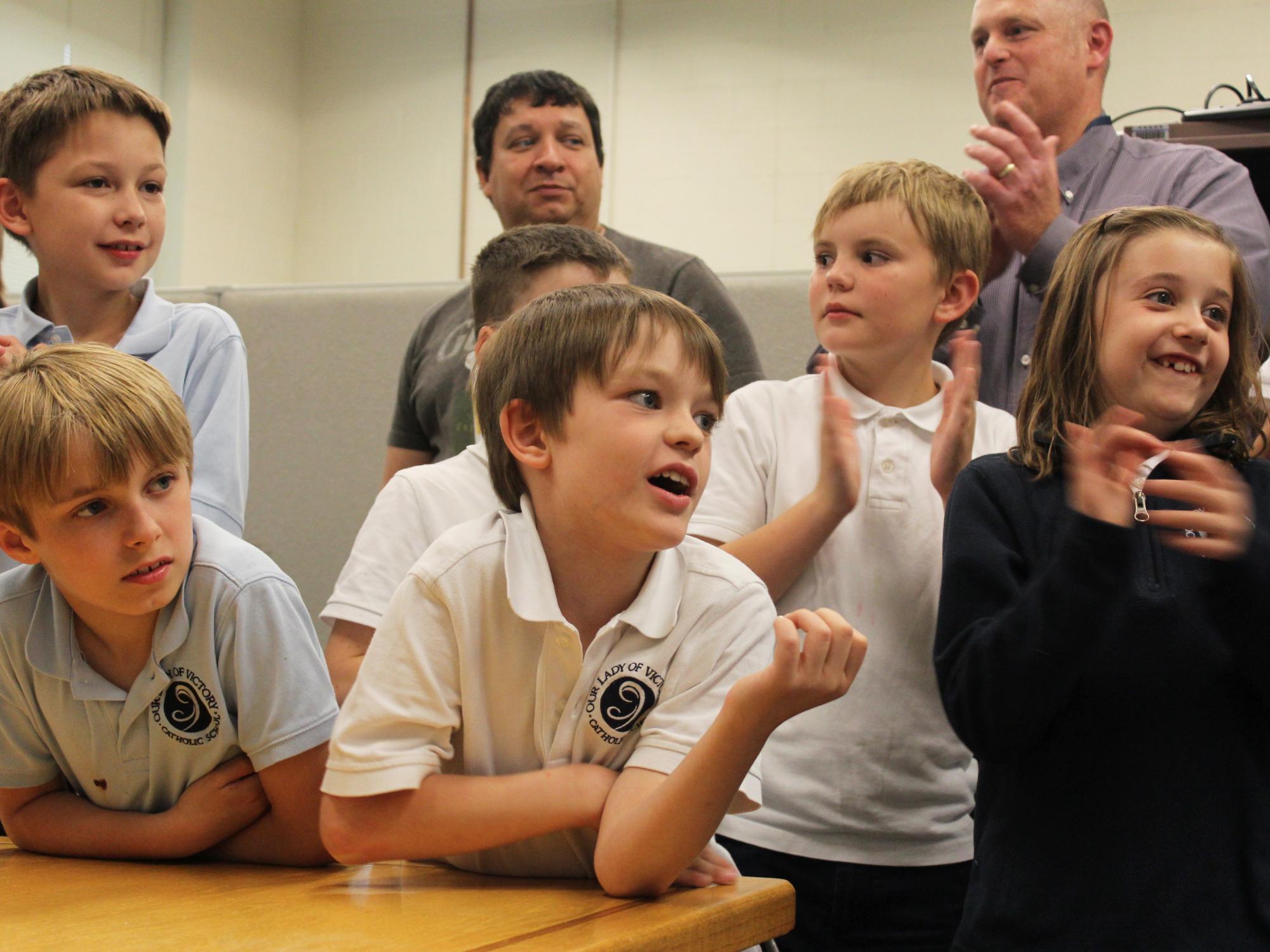 OLV students react to their classmates testing out some of the technologies in the DATA lab.