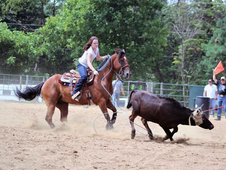Olivia Sribniak on horseback during a roping competition