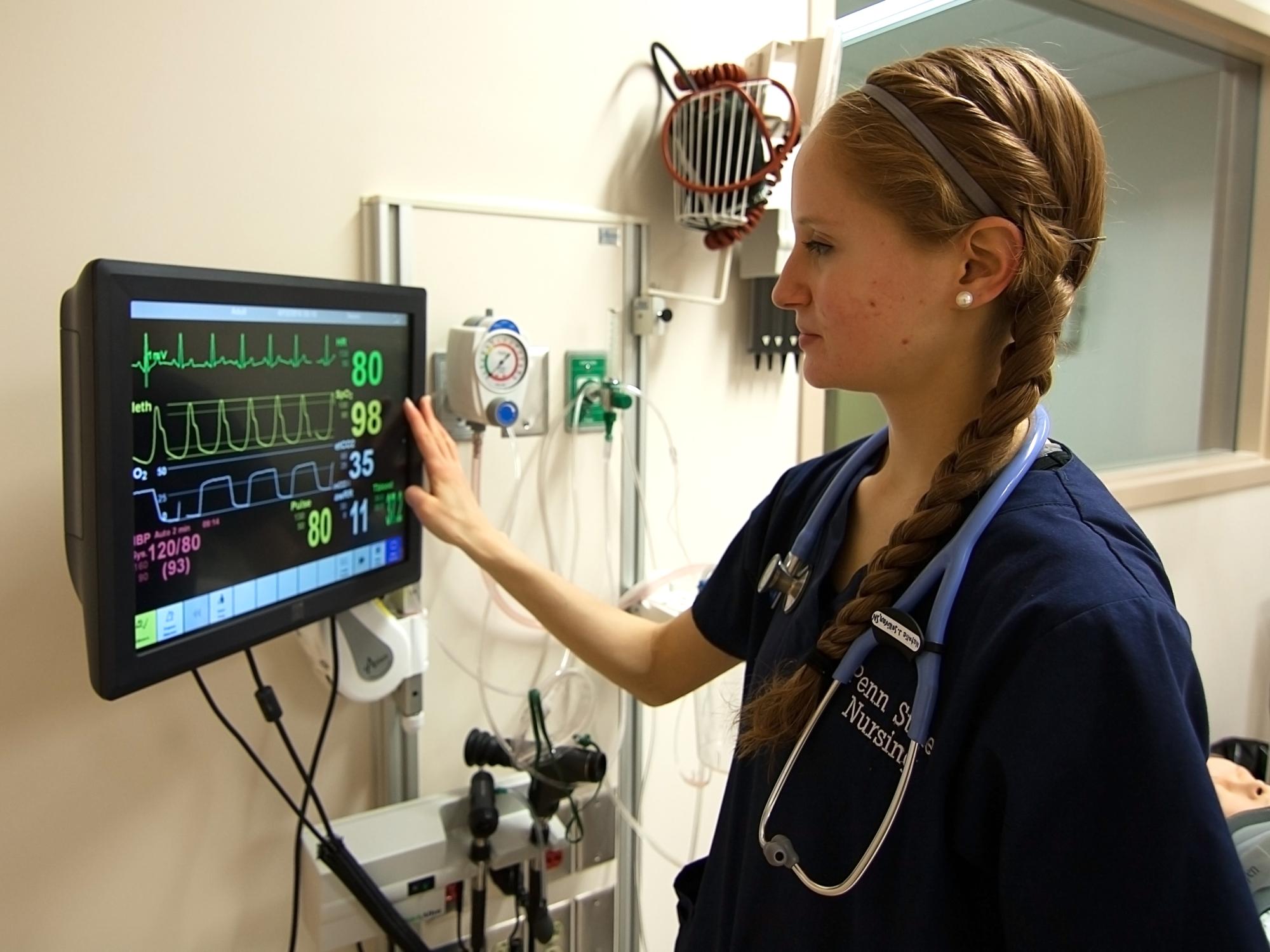 Natalie Sullivan checks a patient's heart rate on the monitor. 