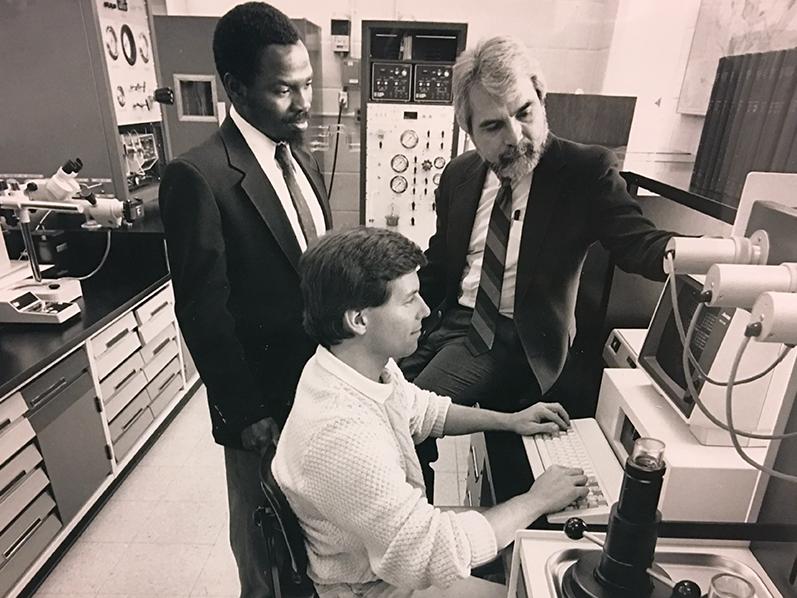 Michael Adewumi, vice provost for global programs and professor of petroleum and natural gas engineering, left, works with a student, seated, and Turgay Ertekin, professor of petroleum and natural gas engineering.