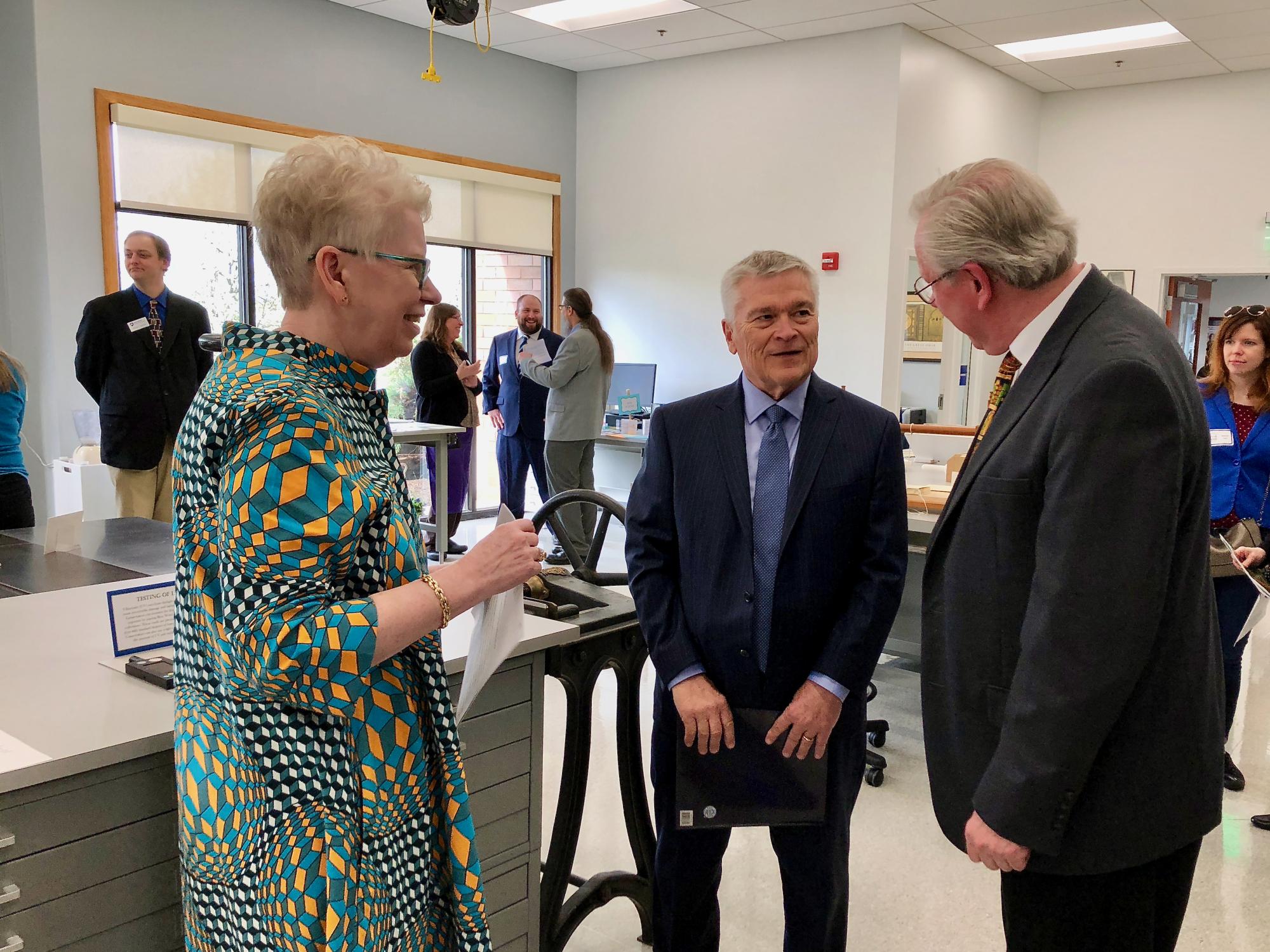 Dean Barbara Dewey, President Eric Barron and Bill Minter