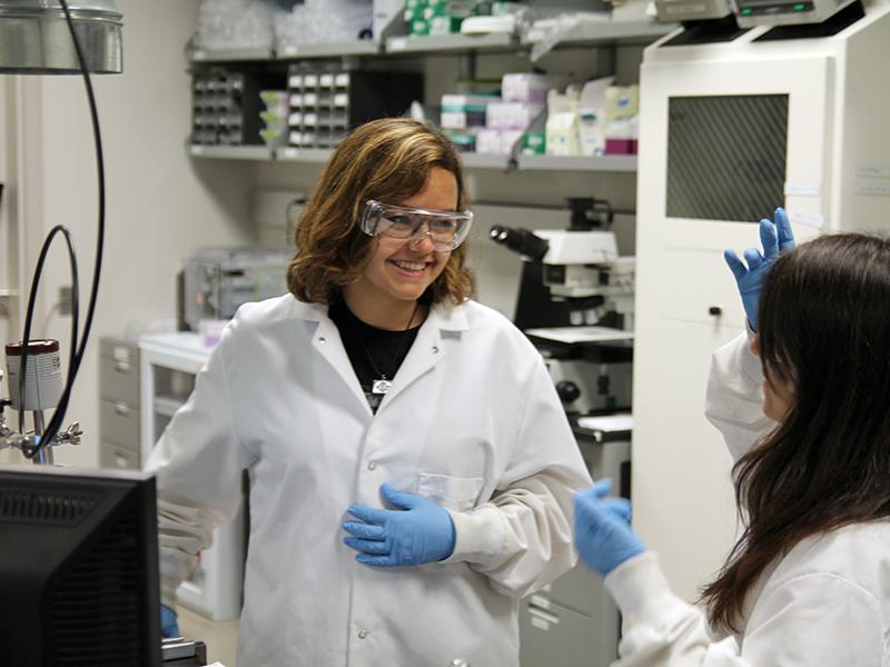 Millennium Scholar Ana Isabel De La Fuente Duran, a first year student majoring in Materials Science (MatSE), is helping Isolina Preciado, a MatSE graduate student.